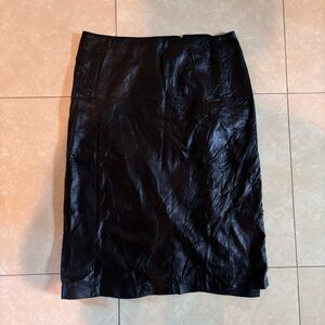 Danier real black leather midi skirt with slit in back. Size 6.